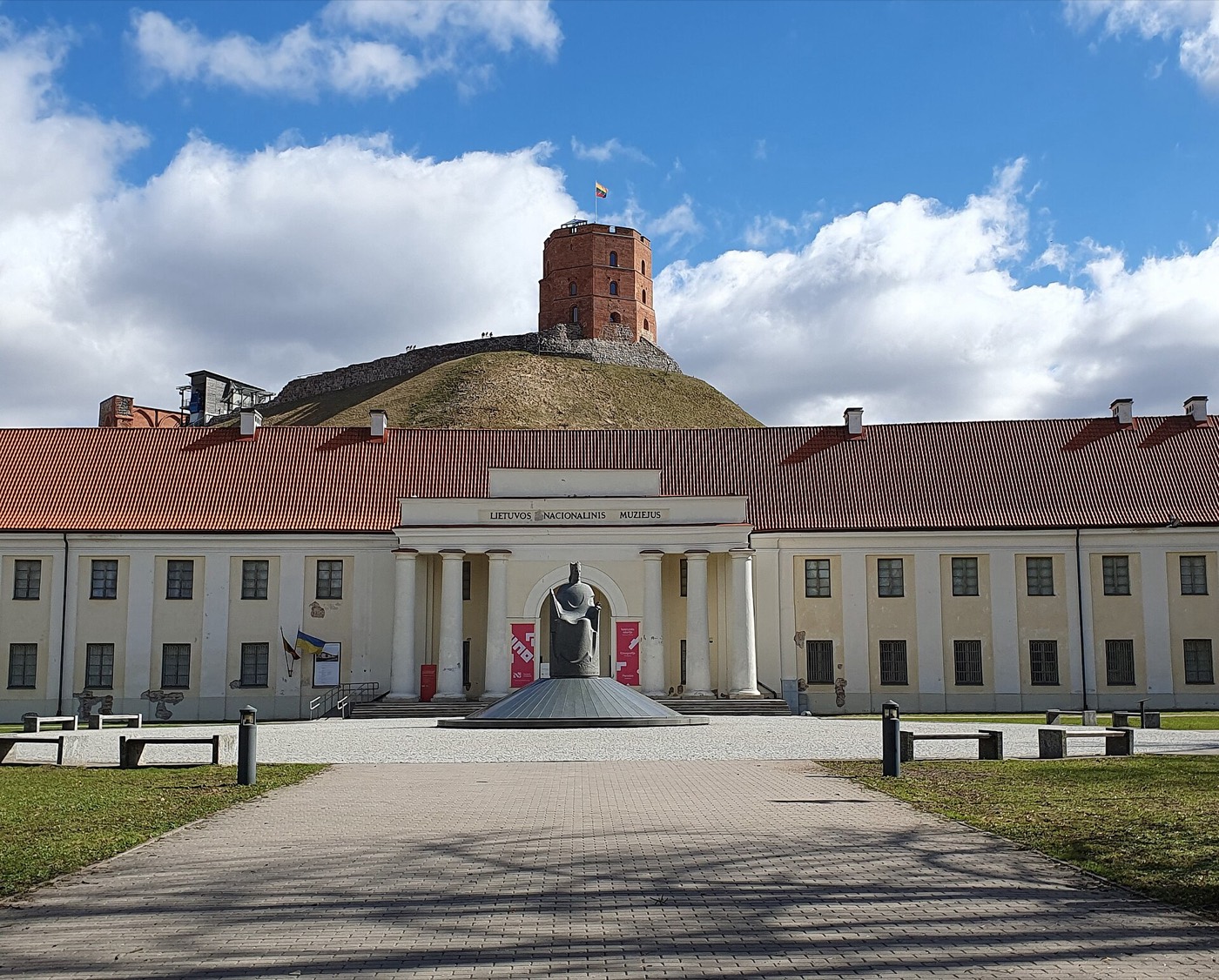 The National Museum of Lithuania with the monument to King Mindaugas at its entrance and Gediminas Tower behind